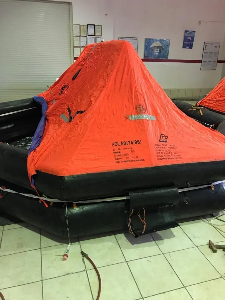 Inflated liferaft inside a service station